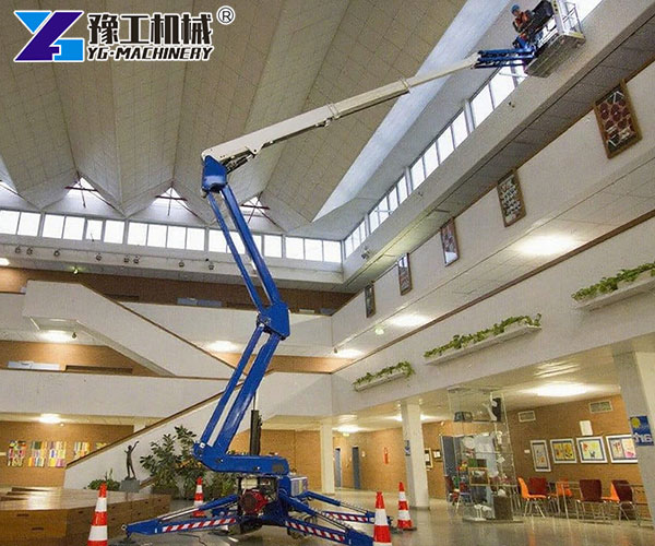 Cherry picker working on indoor high ceiling