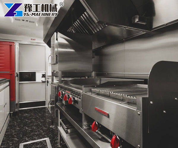 Inside view of fryer, sink, and fridge in fast food trailer