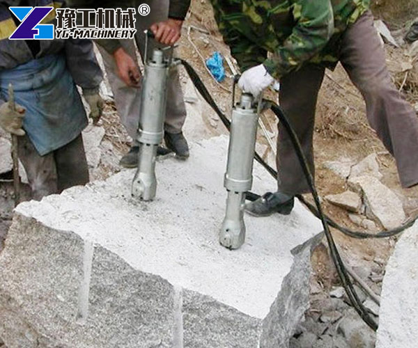 Quarry Rock Splitter Breaking Large Stone Blocks