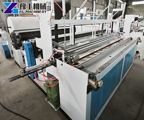 Automatic rewinding and embossing toilet tissue machine