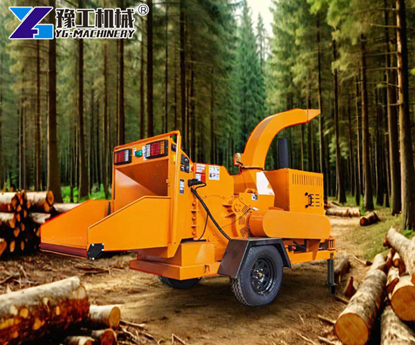 Forestry workers using mobile wood chipper