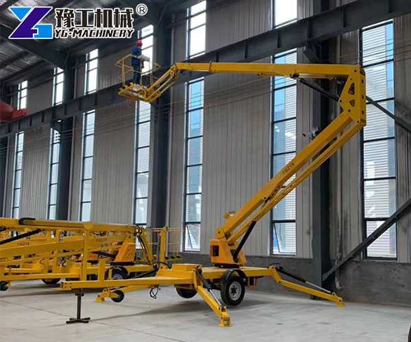 Hydraulic trailer boom lift at warehouse