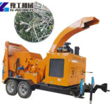 Mobile wood chipper processing tree branches