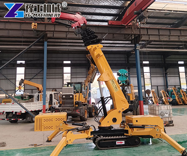Powerful mini crawler crane lifting in a factory setting