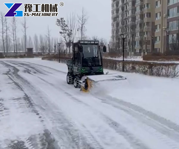 municipal snow cleaning machine on narrow road